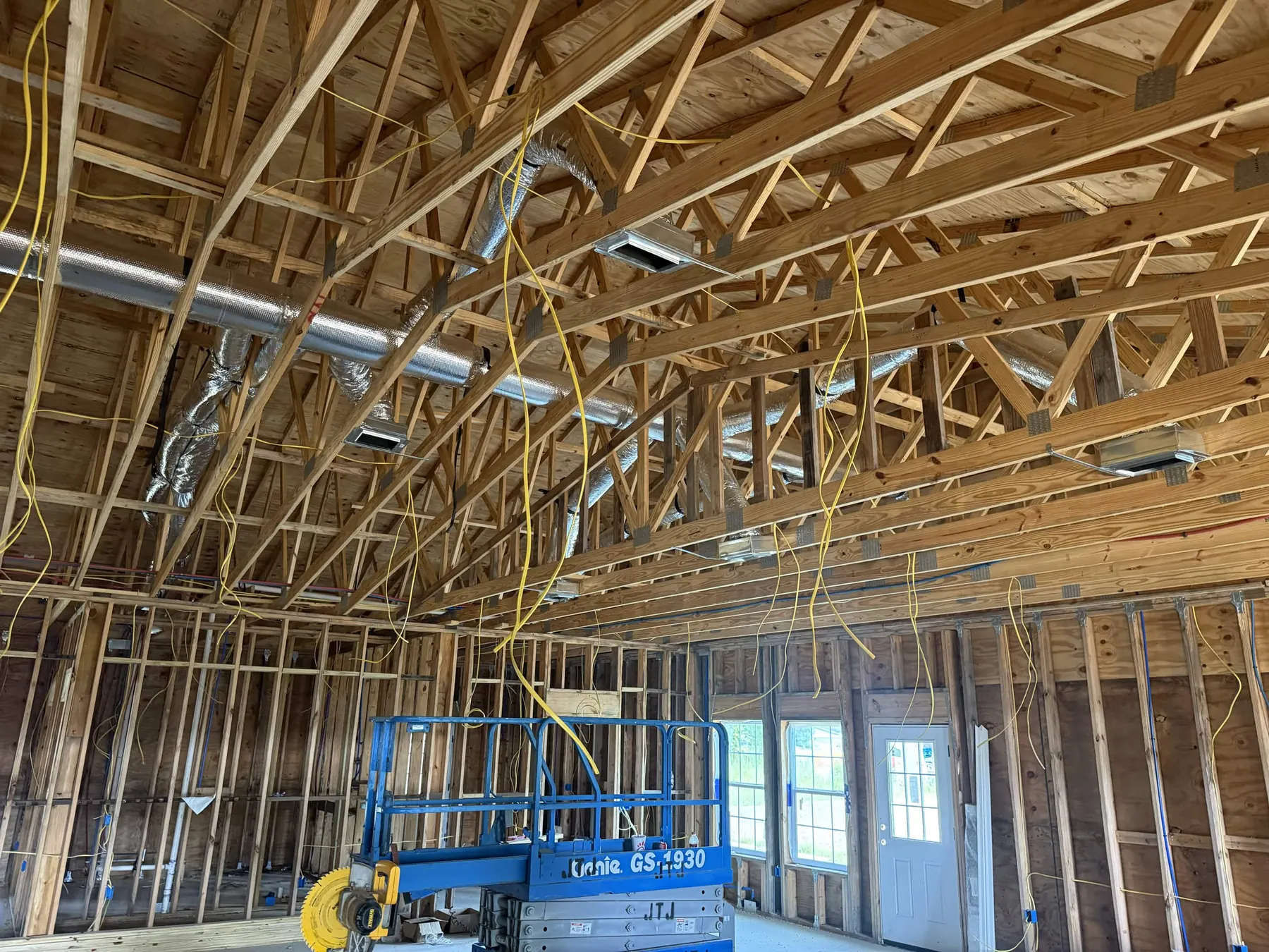 Framed commercial building with coordinated HVAC installation